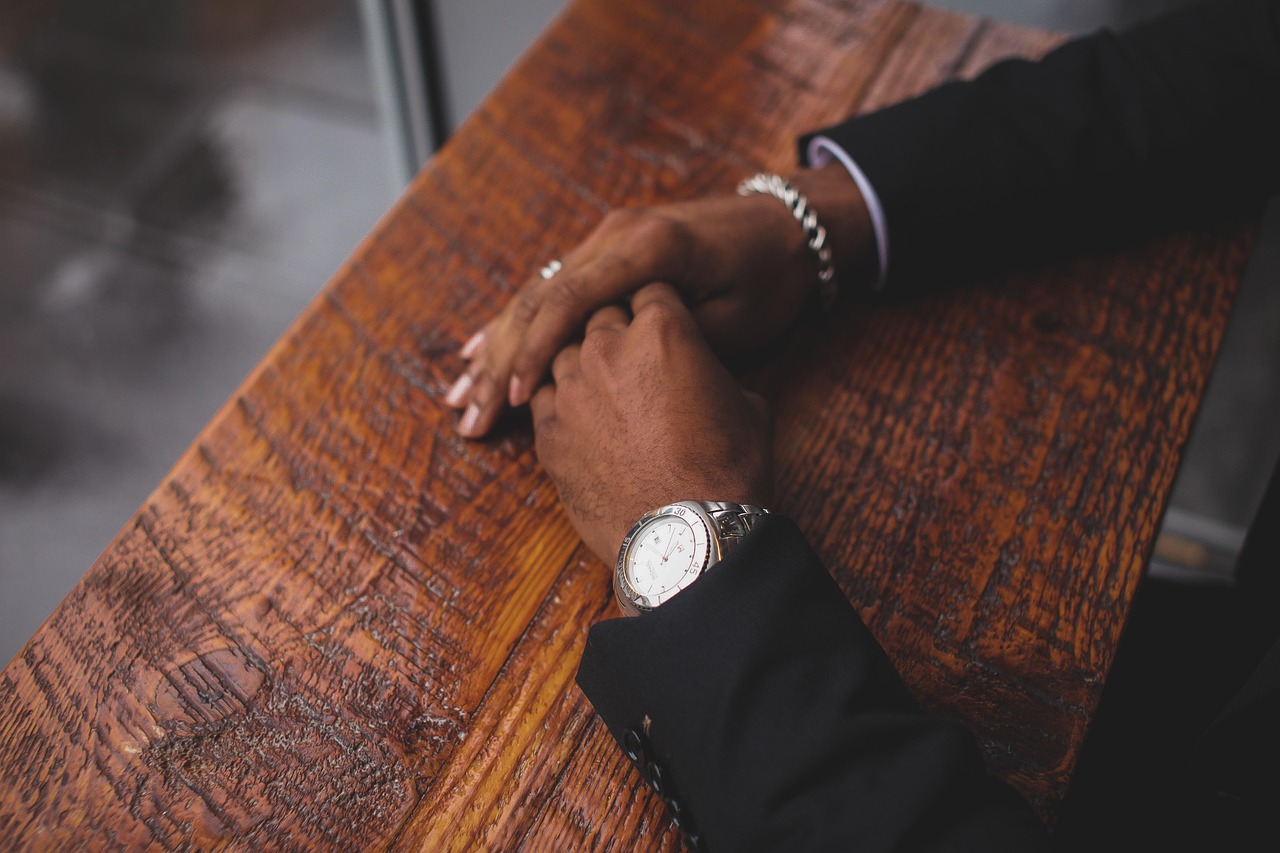 Business, hands, wristwatch — The Resurgence of Vinyl Gloves in Modern Healthcare