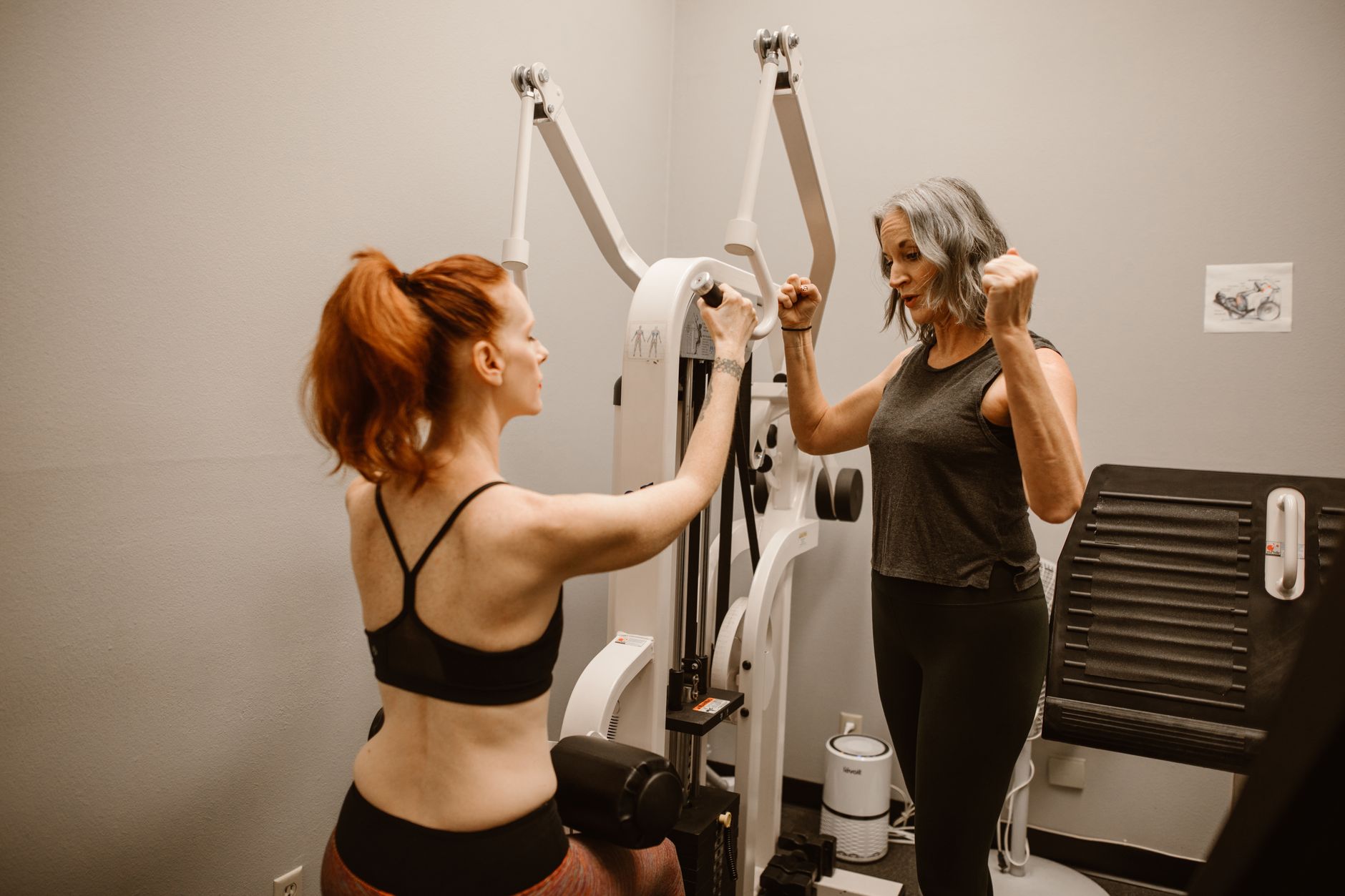 Two women working out with gym equipment indoors, focusing on fitness and healthy living. — Things to know about the natural